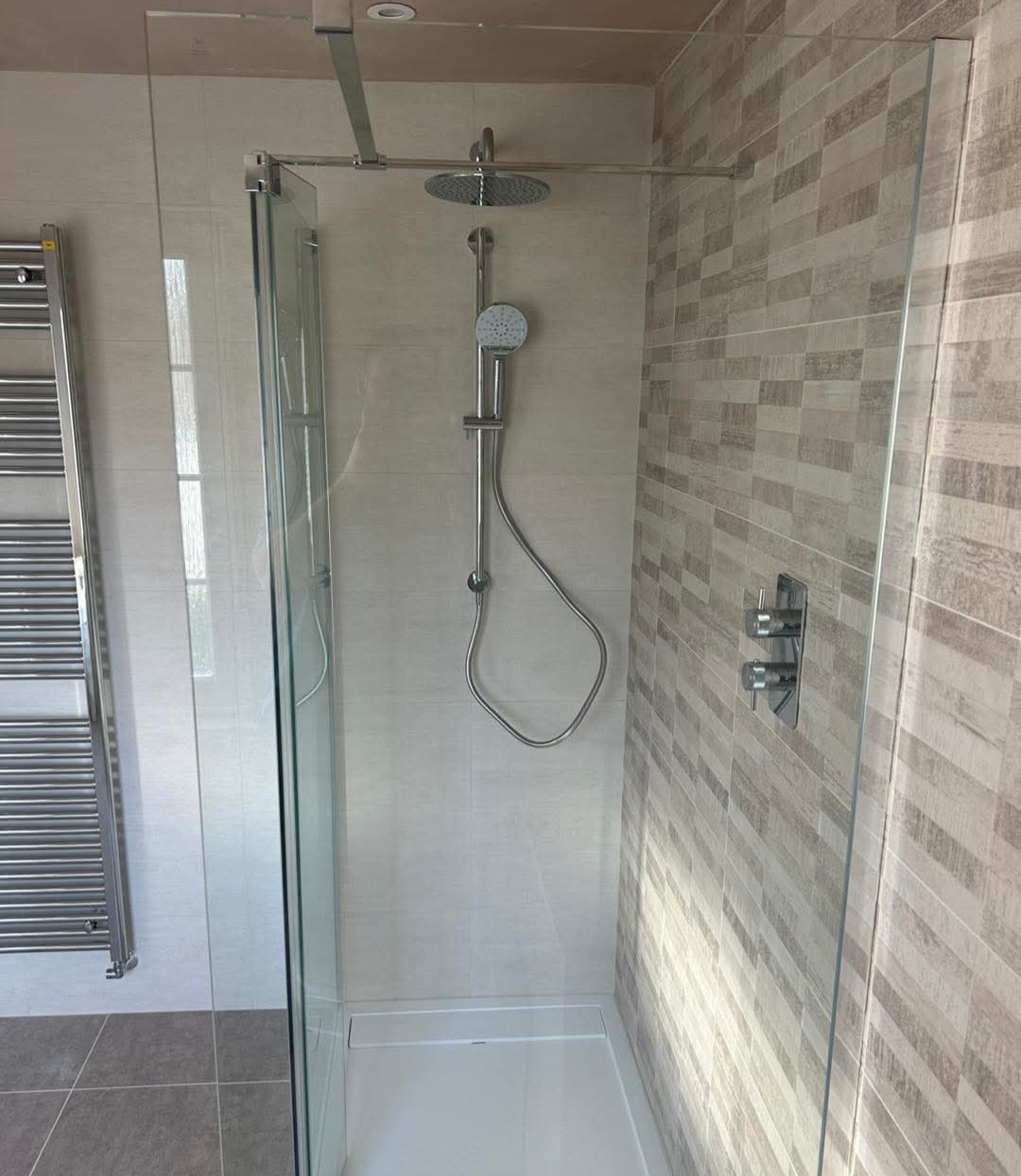 Compact bathroom installation with bath by BDR Bathroom Innovation