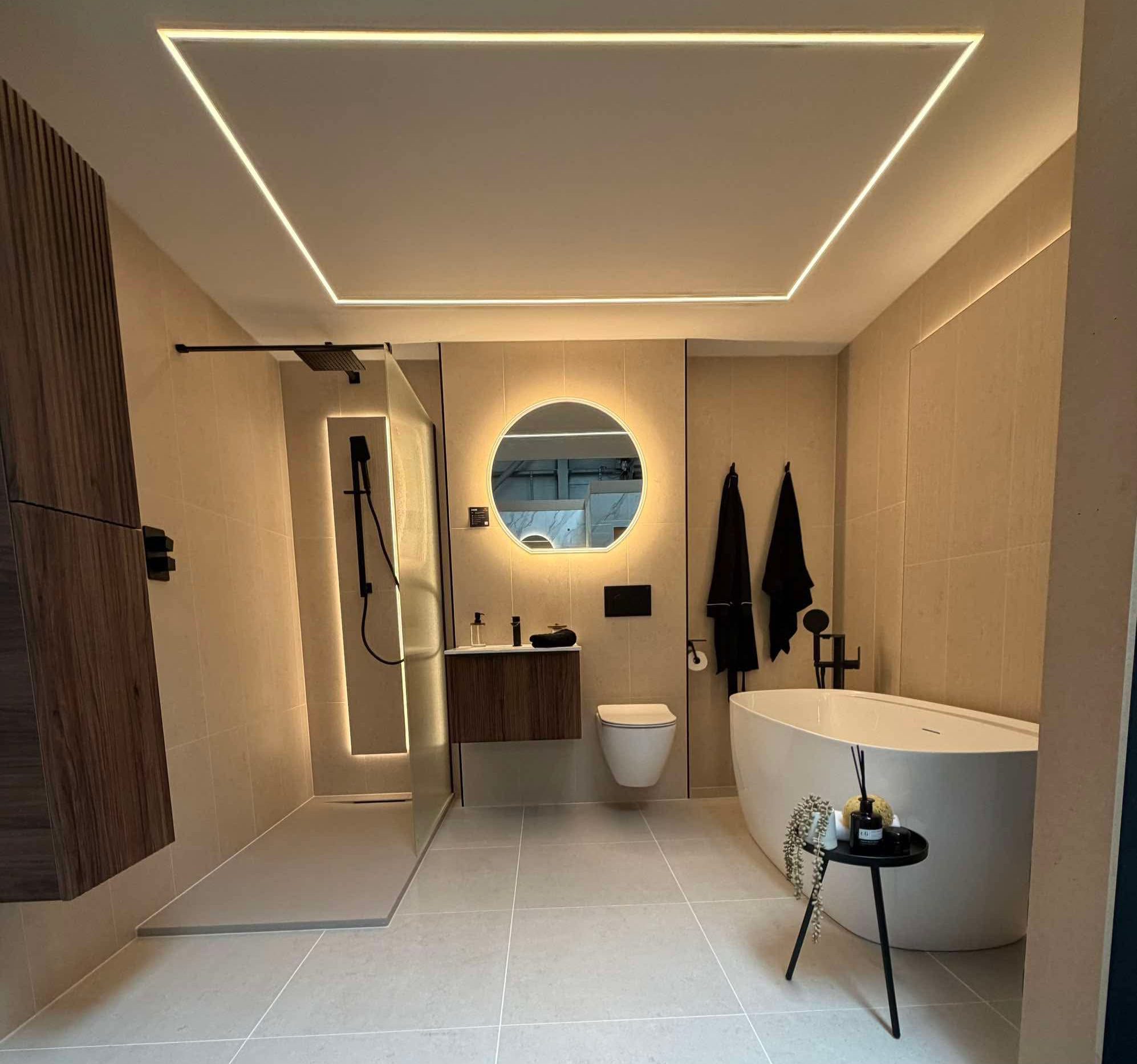 Newly fitted bathroom by BDR Bathroom Innovation, featuring a backlit mirror and illuminated ceiling detail